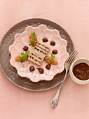 Terrine of foie gras with pepper, fig compote and chocolate jelly on plate