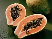 Halved ripe papaya with seeds