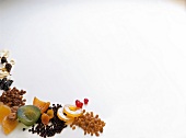Various nuts and dried fruits used in cakes and pies on white background
