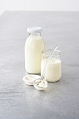 Milk and cream in bottle with spoon