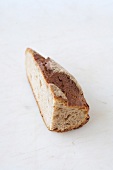 Piece of bread on white background
