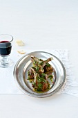 Lamb chops with cilantro vinaigrette on plate