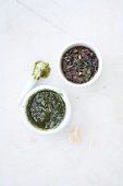 Tapenade and pesto genovese in two bowls