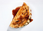 Norman crepes with sauce on white background