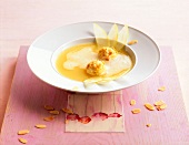 Apple-champagne soup with brittle-quark dumplings on plate