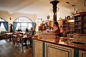 Guests sitting at tables in Beim Sedlmayr restaurant, Munich, Germany