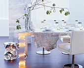 Festively decorated table in white-silver accents with zebra pattern table cloth