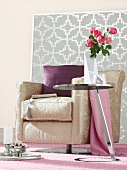 Room with pink carpet and sofa with purple cushion against white-silver patterned mosaic
