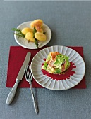 Serrano ham with savoy cabbage and potatoes on two plates