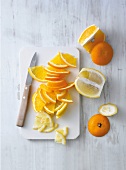 Slice of oranges on chopping board