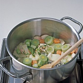 Vegetables being boiled in casserole, step 1