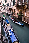Gondolas in narrow canal, Venice, Italy