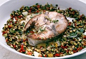 Close-up of raw tuna piece marinated with red wine and herbs