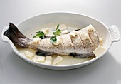 Raw cod stew with herbs in serving dish