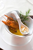 Crayfish with parsley and almonds in ceramic bowl