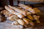 Stack of baguettes in bakery, Les Cuisiniers Cavistes, Narbonne, France