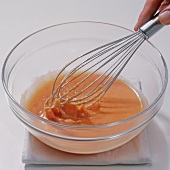 Sauce in bowl with whisk, step 6