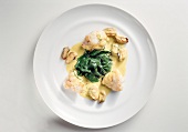 Monkfish medallions on plate, overhead view
