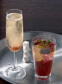 Two champagne cocktail and Russian spring punch on tray