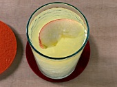 Orchard breeze with apple slice in glass