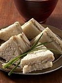 Close-up of chicken and herb sandwiches on plate