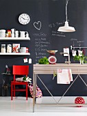 Creative kitchen - wall painted with blackboard paint and covered in chalk notes