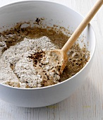 Close-up of mixture of sourdough with various ingredients in bowl