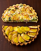 Halves of quiches broccoli pie and vegetables cake with apple