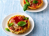Small tomato quiche with basil on plate