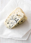 Piece of blue cheese on wax paper