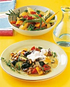 Oven ratatouille on plate and roasted vegetables in bowl