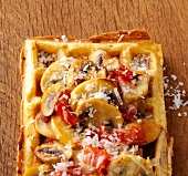 Close-up of waffles with mushrooms and parmesan