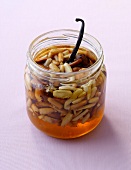 Roasted nuts with honey in glass jar