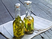 Two glass bottles of lemon herbal oil