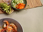Asparagus, carrots, spring onions and shrimp, copy space