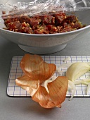 Marinated lamb with onion, garlic and ginger in wok