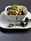 Bowl of mussels with fennel and coconut sauce in bowl