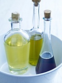 Three bottles of olive, soybean and sunflower oil