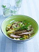 Couscous salad with lamb, aubergines and dates