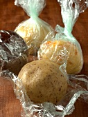 Close-up of cookie dough in cling film for preparation of biscuits