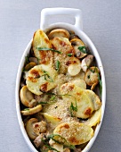 Close-up of baked potatoes and mushroom in casserole