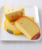 Pieces of gouda and edam cheese on plate