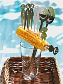 Corn cob on face shaped corn cob holder