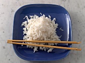 Basmati rice with chopsticks on plate