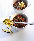 Soba noodle salad with raw tomatoes in cups