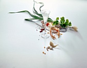 Lobster, shrimp, leeks, cilantro, garlic and chili on white background