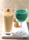 Blue flower juice and tropifrutti made from physalis in glass