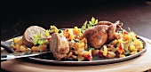 Chicken with vegetables and knife in serving dish