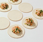 Prawns and vegetables filling on dough circles, step 1