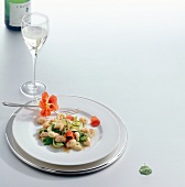 Spring crab with vegetables on plate served with white wine